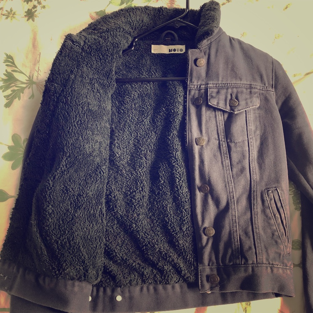 Blue denim jacket with black faux sheep lining.